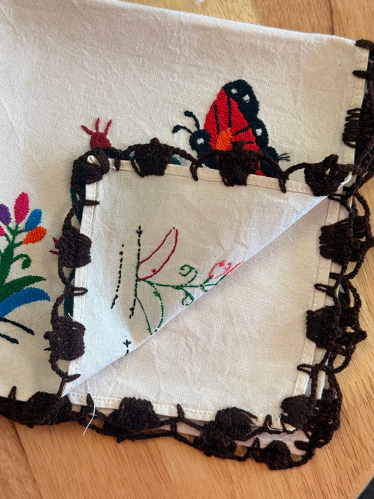 LIMITED EDITION: “Mariposa & Nopal Hand-Embroidered Napkin.”